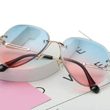 Oversized rimless blue and pink gradient aviators