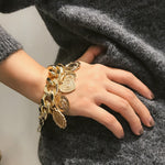 Big chunky gold charm bracelet